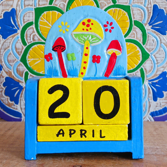 Bring a touch of whimsy and eco-friendly charm to your desk with this hand-painted wooden mushroom perpetual calendar. Perfect for your work, study, or creative space, this fun desk accessory makes organizing your days delightful. Simply rotate the wooden blocks to update the date—no waste, no replacement pages, just timeless functionality you can enjoy year after year. A thoughtful, sustainable gift for nature lovers, students, and anyone who enjoys a touch of woodland magic in their daily routine.