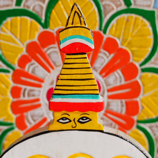 Bring a sprinkle of harmony to your everyday routine with the Nepal Stupa Wooden Calendar. Crafted from lightweight, durable wood, this enchanting piece combines functionality with fairy-tale charm. Each day, simply rotate the wooden blocks to keep track of the date—no need for replacements, making it a timeless addition to your home or office.