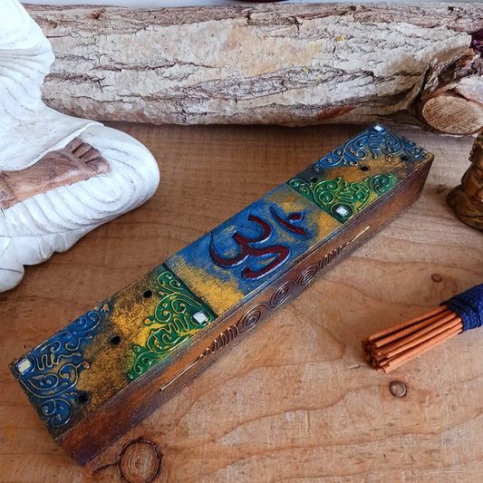 This unique incense stick holder is perfect to catch the ash from your favourite incense. It has been handmade from responsibly sourced wood, skillfully carved and decorated with a centre OM symbol.
