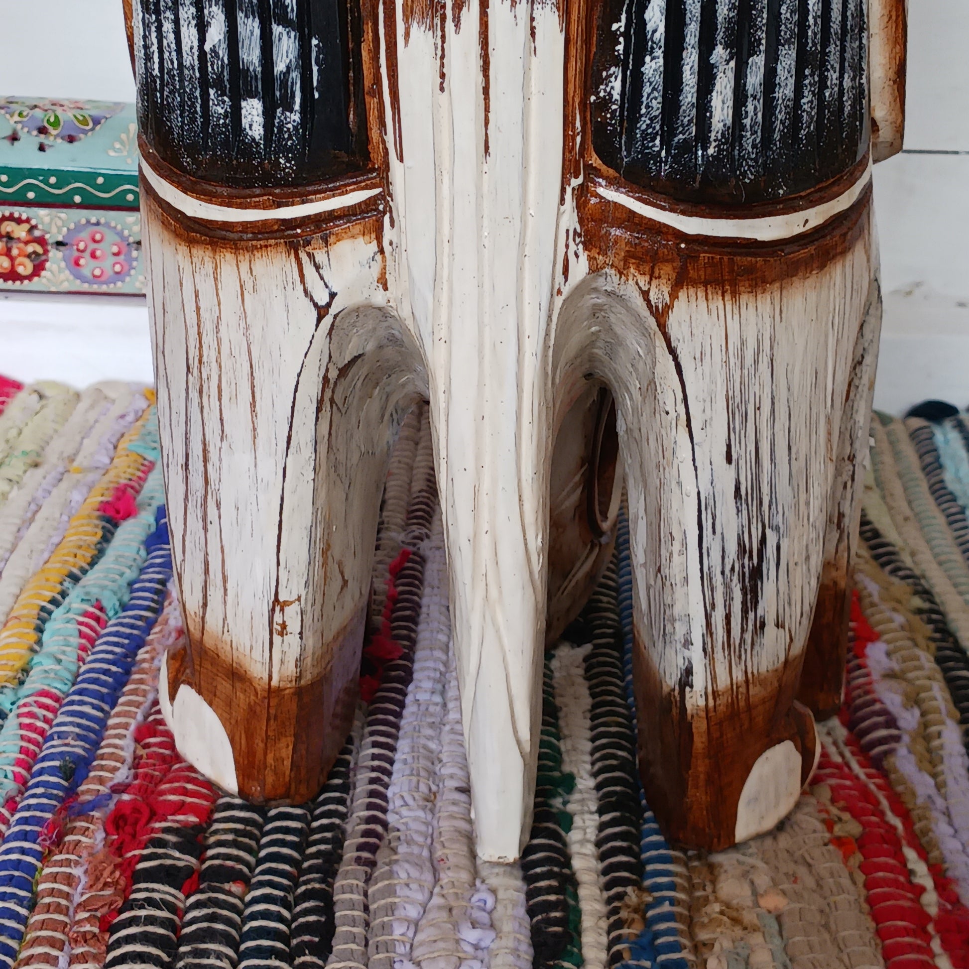 Hand carved from ableisa wood, this stunning elephant makes a great side table, coffee table. plant table or stool. This beautiful elephant piece is handmade and painted by artisans who have strong roots in storytelling and artwork that spans generations - this elephant is the perfect example!