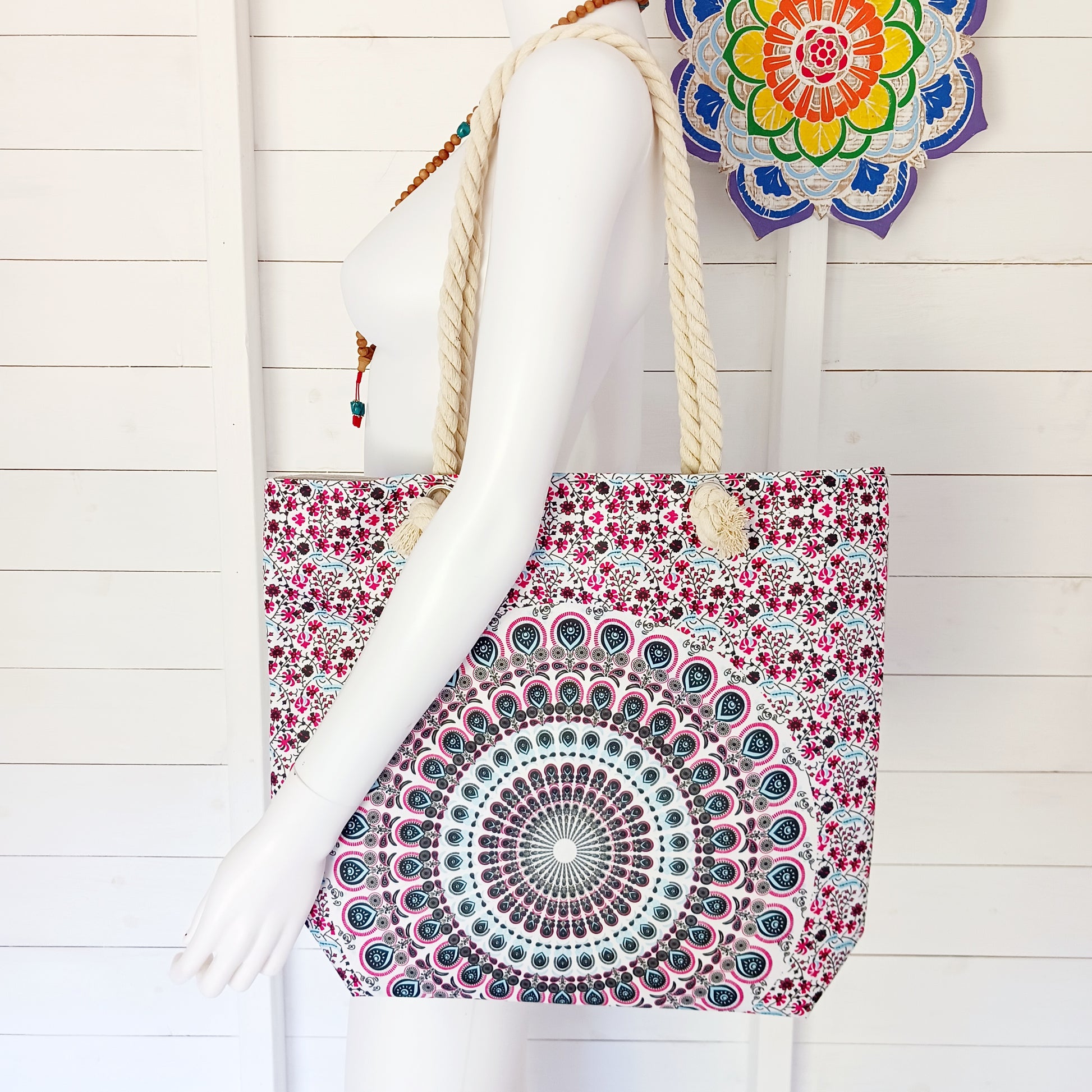 Add a splash of colour and bohemian style to your everyday look with this charming Mandala Bag. Featuring an eye-catching patterned design, this spacious shoulder bag is perfect for carrying your daily essentials while shopping, travelling or enjoying a day at the beach.