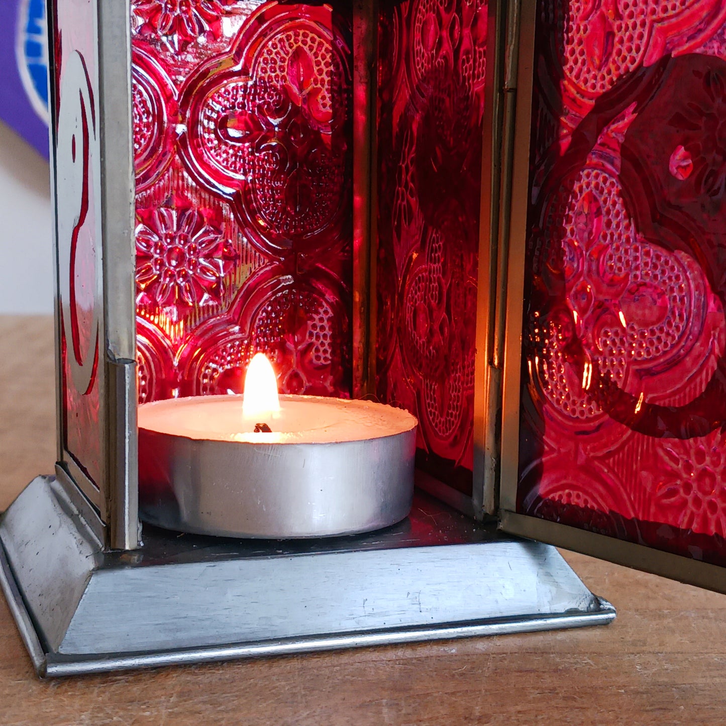 Bring warmth, colour and spiritual harmony to your home with this beautiful Yin Yang Glass Lantern. Designed with vibrant coloured glass panels and a decorative metal cut-out canopy, this lantern creates a calming glow that enhances meditation spaces, yoga rooms and home décor.