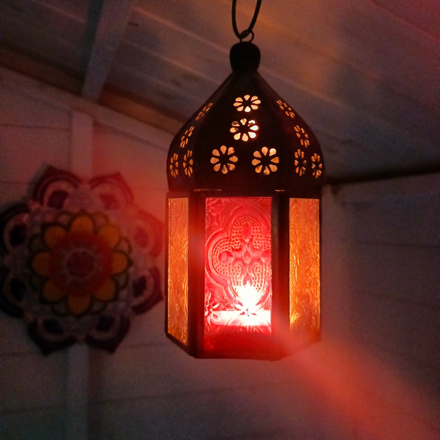 These small glass lanterns come in wonderful colours, featuring an intricate embossed pattern. They have a small hinged door that closes with a sliding catch. The small handle on the top is great for hanging the lanterns around your home. Perfect for adding a touch of warmth to your space.