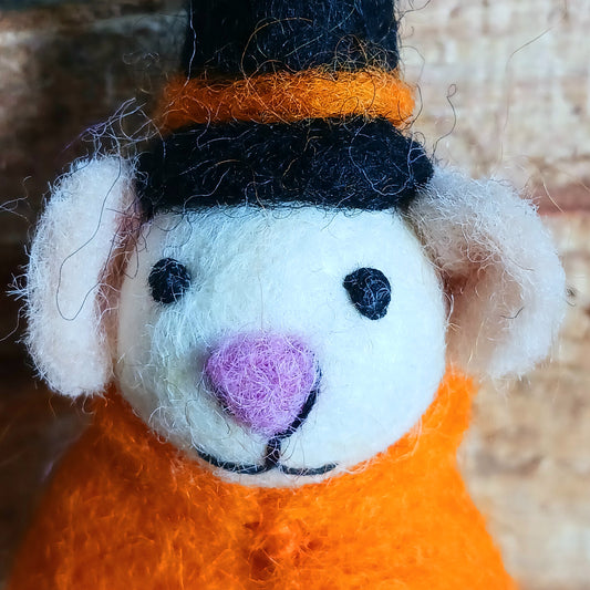 Bring a touch of handcrafted Halloween charm to your home with these delightful felted mice dressed as a playful “Boo” character. Each mouse features adorable details including long tails, soft pink ears and noses, and colourful pointed hats and capes. These little mice have a “Boo” sign—and comes with a black-and-white hanging thread, perfect for decorating branches, hooks, garlands, or spooky seasonal displays.