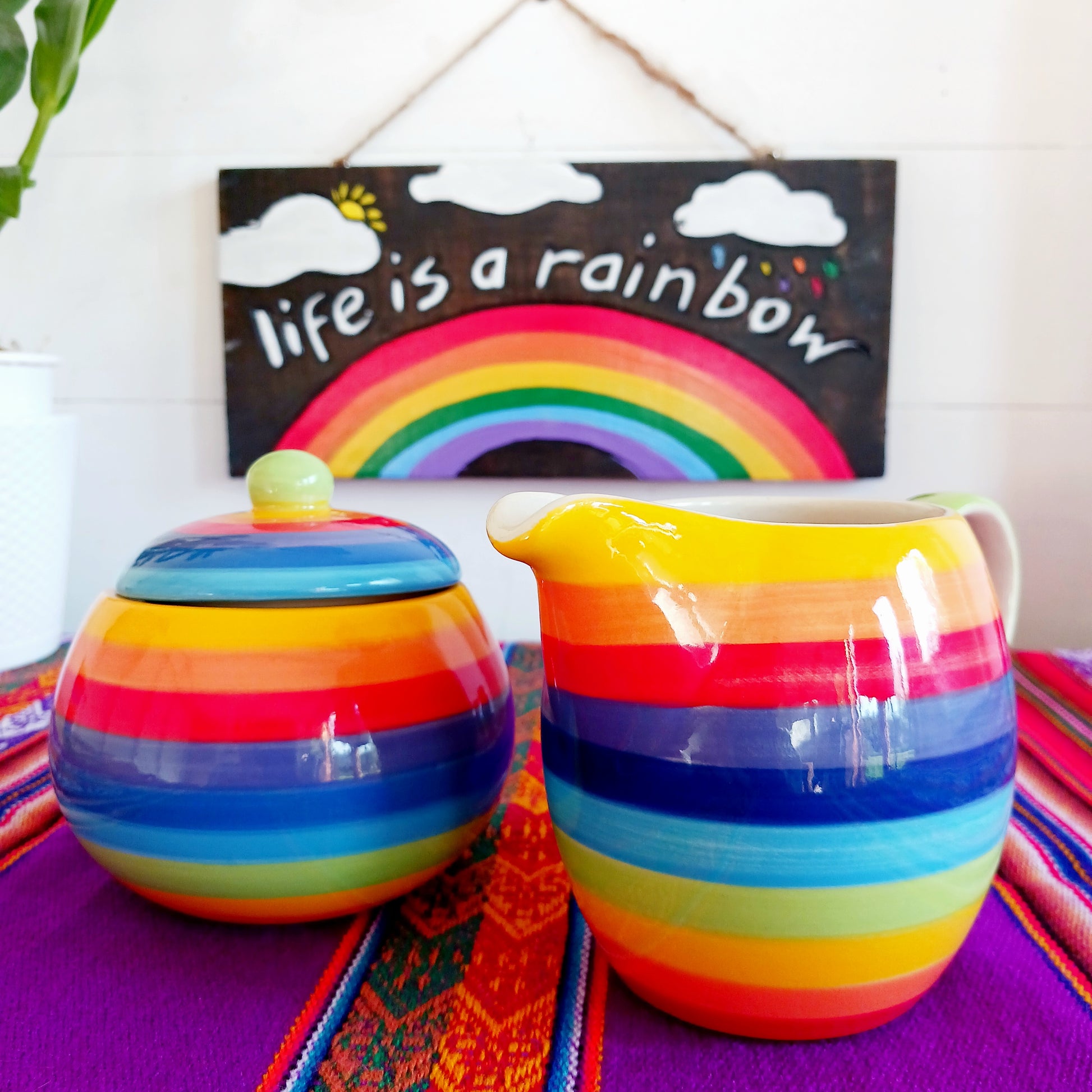 This rainbow stripe ceramic milk jug will brighten up any home. The vibrant stripes are hand painted giving each piece individual character.