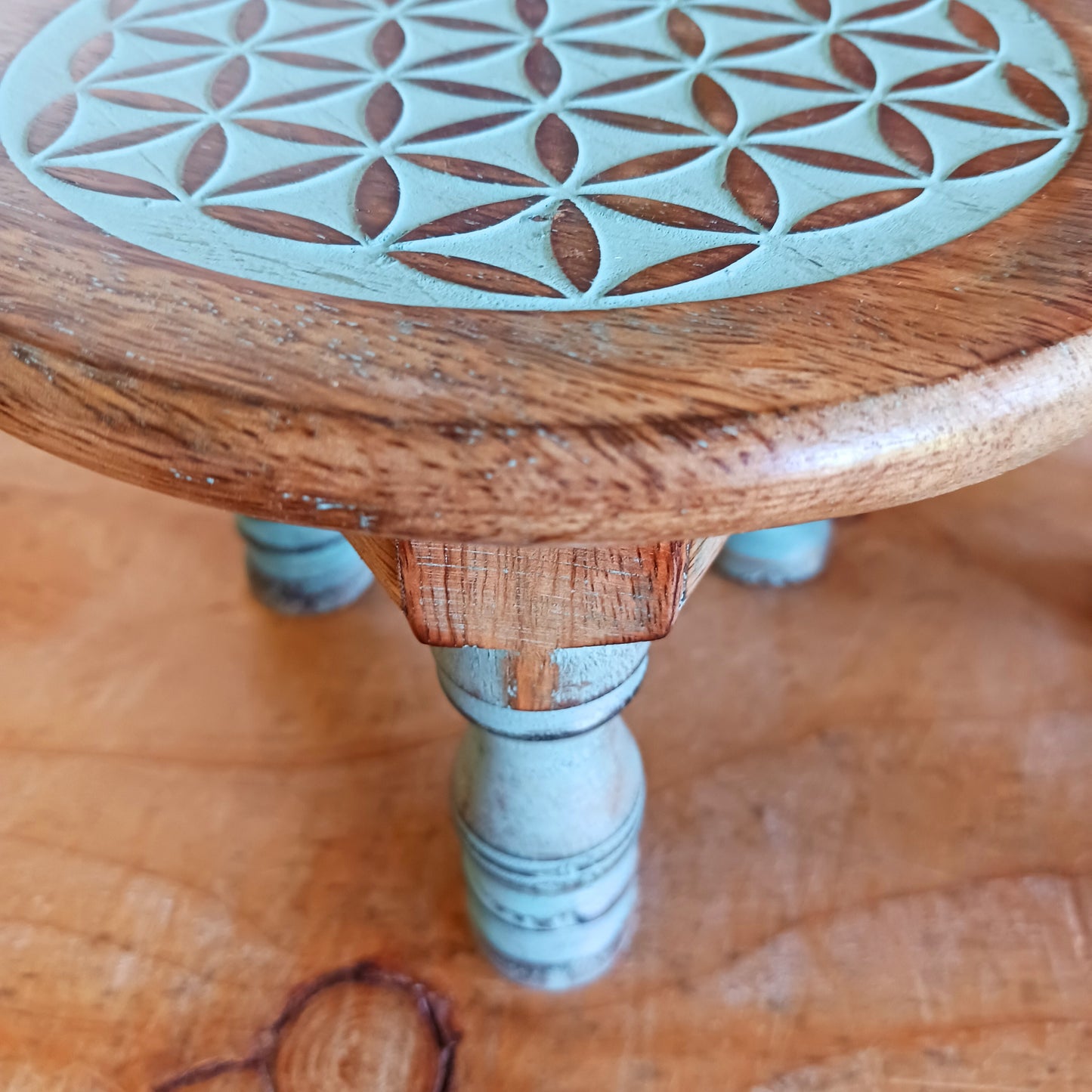 Bring the beauty of sacred geometry into your space with these compact Flower of Life tables. Handcrafted from solid mango wood, each table features a finely engraved Flower of Life symbol on top – an ancient pattern representing the interconnectedness of all life. 