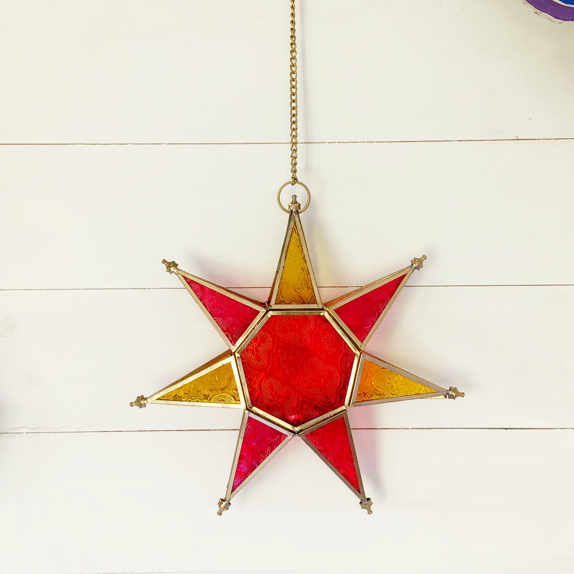These Moroccan style star glass lanterns are handcrafted by skilled artisans and come in beautiful rich colours that catch the eye and instantly add atmosphere to any room.