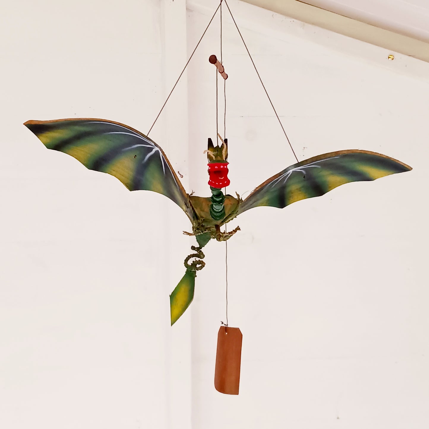 Bring a touch of magic and movement to your home or garden with this Large Green Coconut Dragon Mobile, a beautifully handcrafted decorative piece handmade in Indonesia.