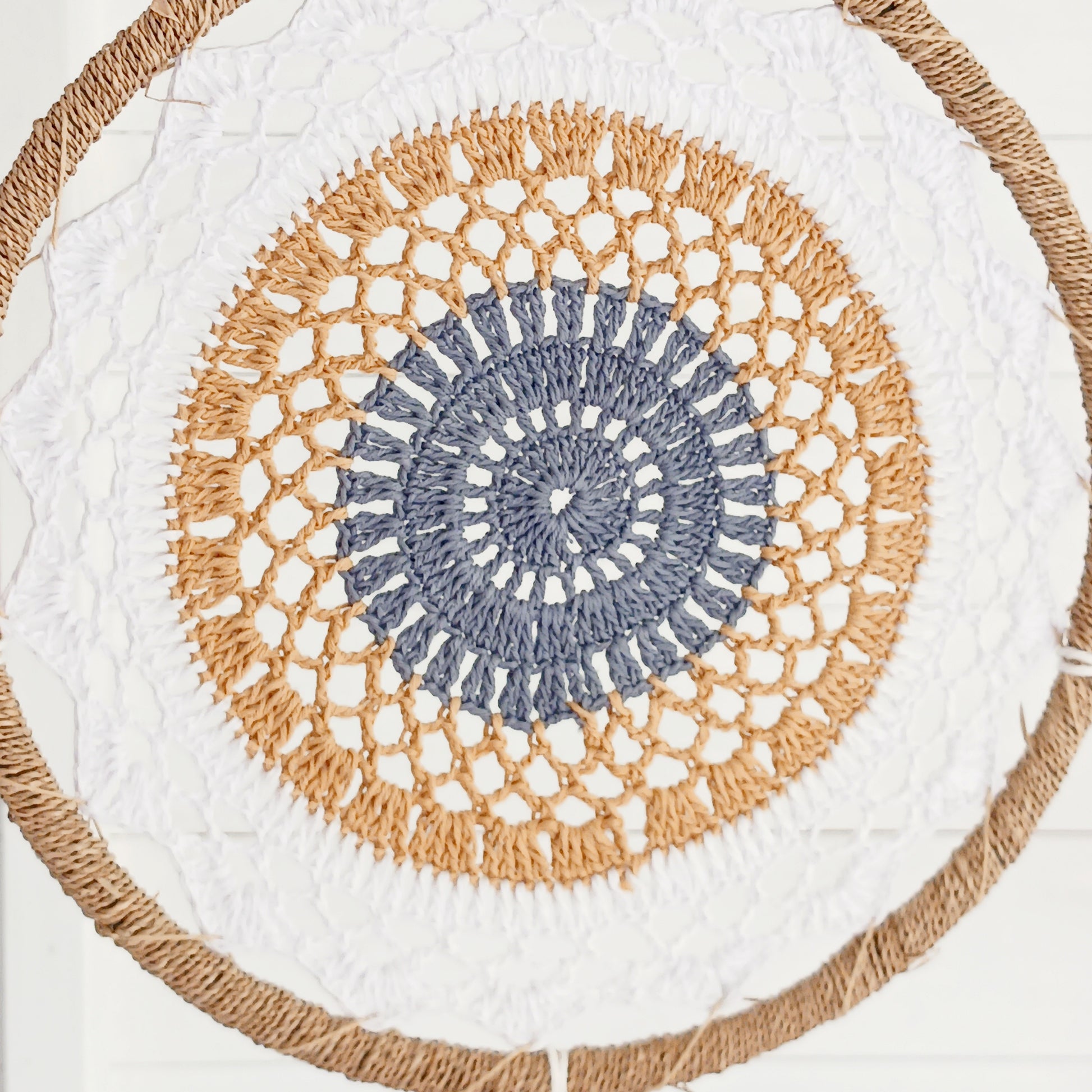 Bring peace, balance, and natural elegance into your home with this handmade large brown Elemental Spirits Dream Catcher. Crafted with love and care on the spiritually blessed island of Bali, this vegan-friendly piece is made entirely from natural materials, free of feathers. Its earthy tones and organic textures create a warm and grounding presence, perfect for bedrooms, meditation spaces, or as a thoughtful gift.