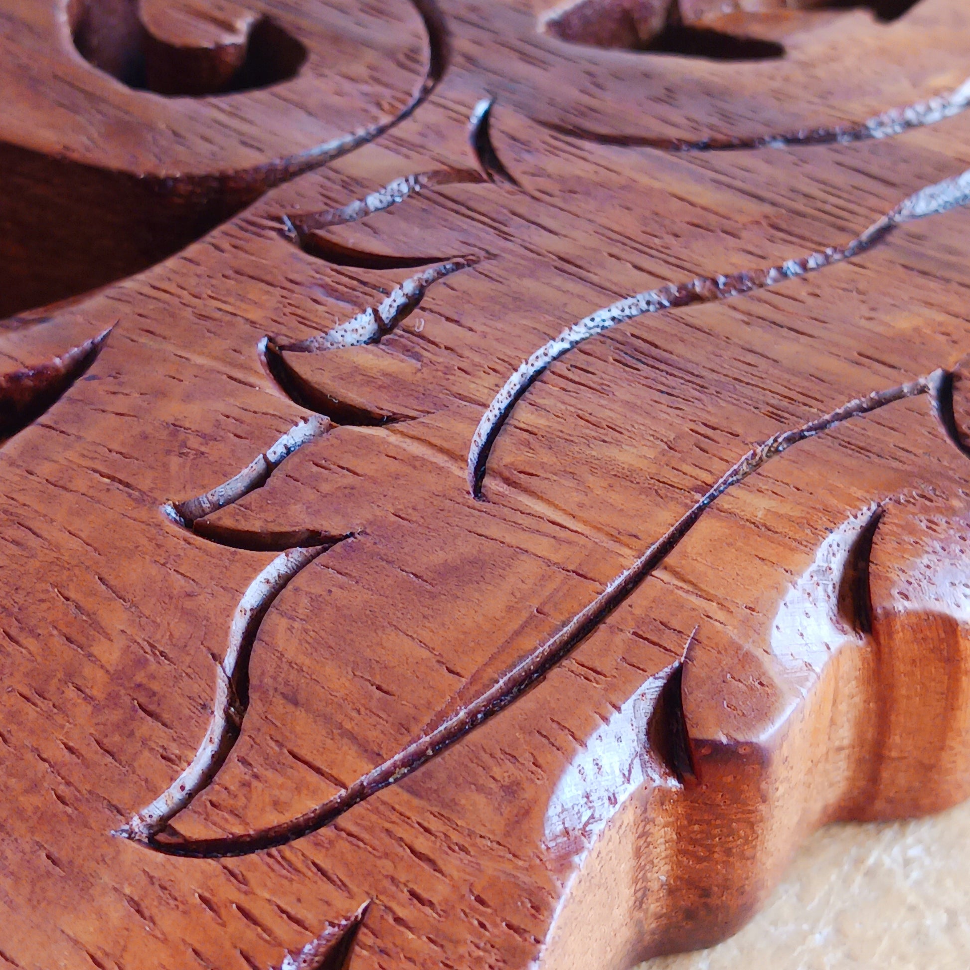 Bring the spirit of the wild into your home with this beautiful and striking Howling Wolf Celtic Knotwork Wooden Plaque. Hand-carved by skilled artisans in Bali, this open-work wooden wall plaque features an upright wolf with its head thrown back in a powerful howl.