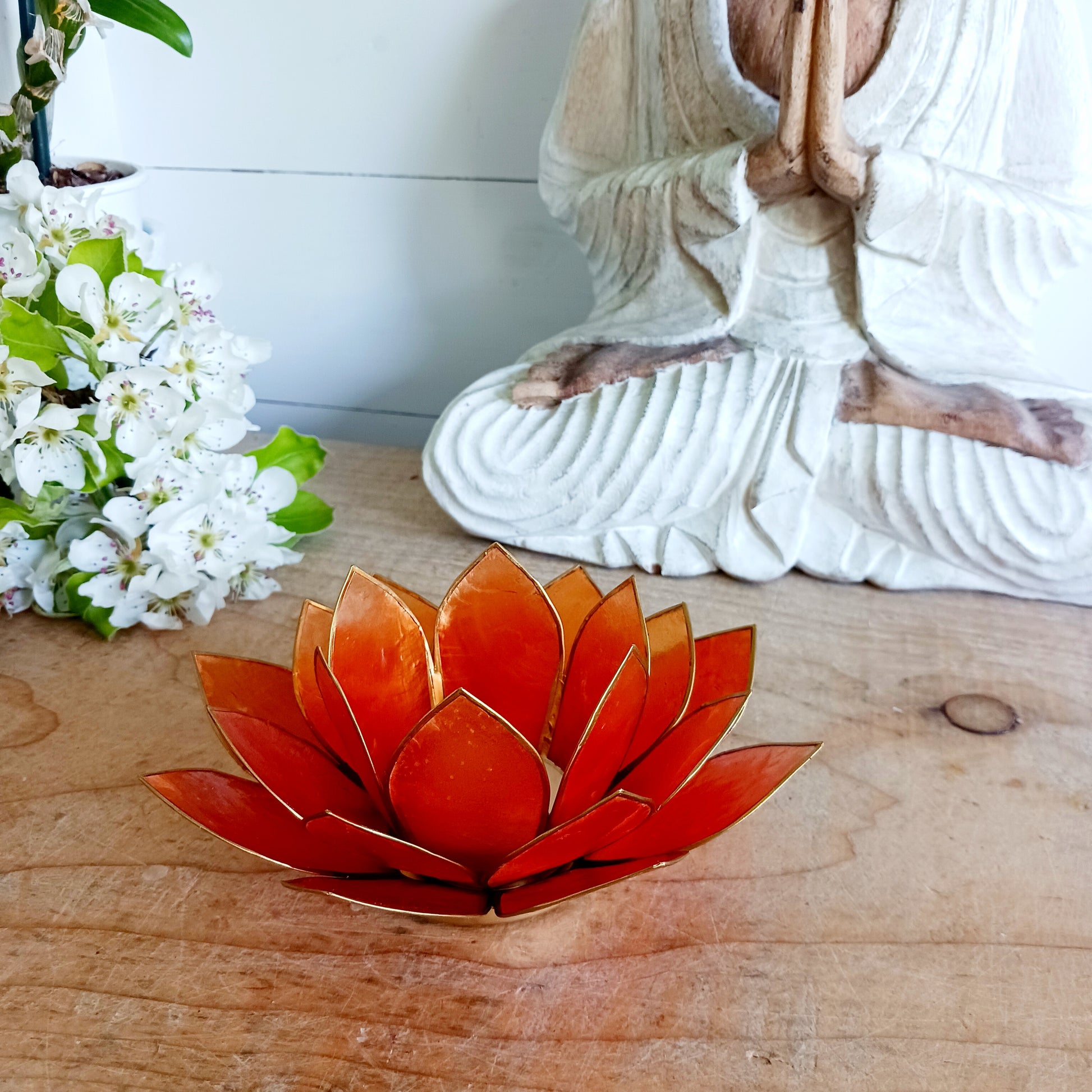 The Lotus Flower is a symbol of achieving enlightenment, peacefulness and spirituality. This beautiful candle holder can be fitted with tealight candles or slightly larger candles. The diameter of the middle is roughly 5.5cm, so it will fit any candle with the same diameter.