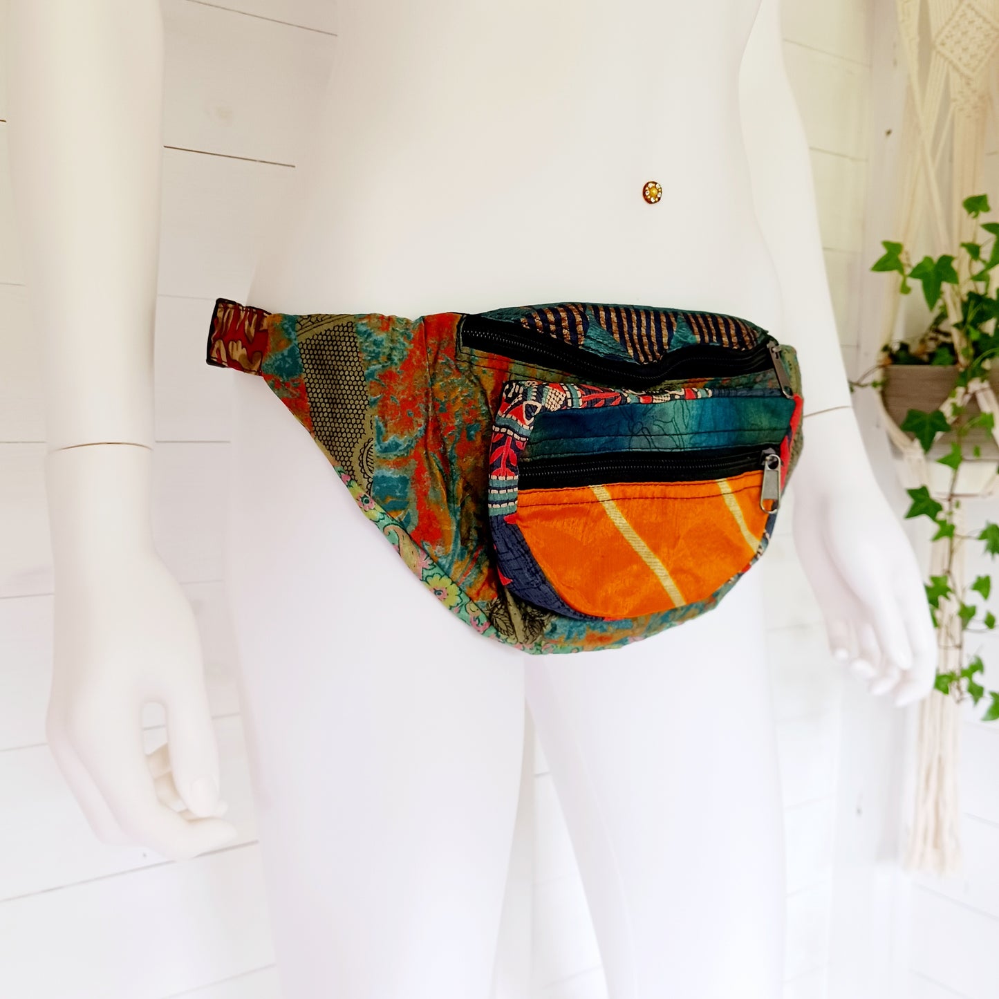 A fun style bum bag made from a patchwork of pretty sari materials. The waistband is adjustable and there is an extra secure zip compartment for easy access. This bag can also be worn across the body for extra security.