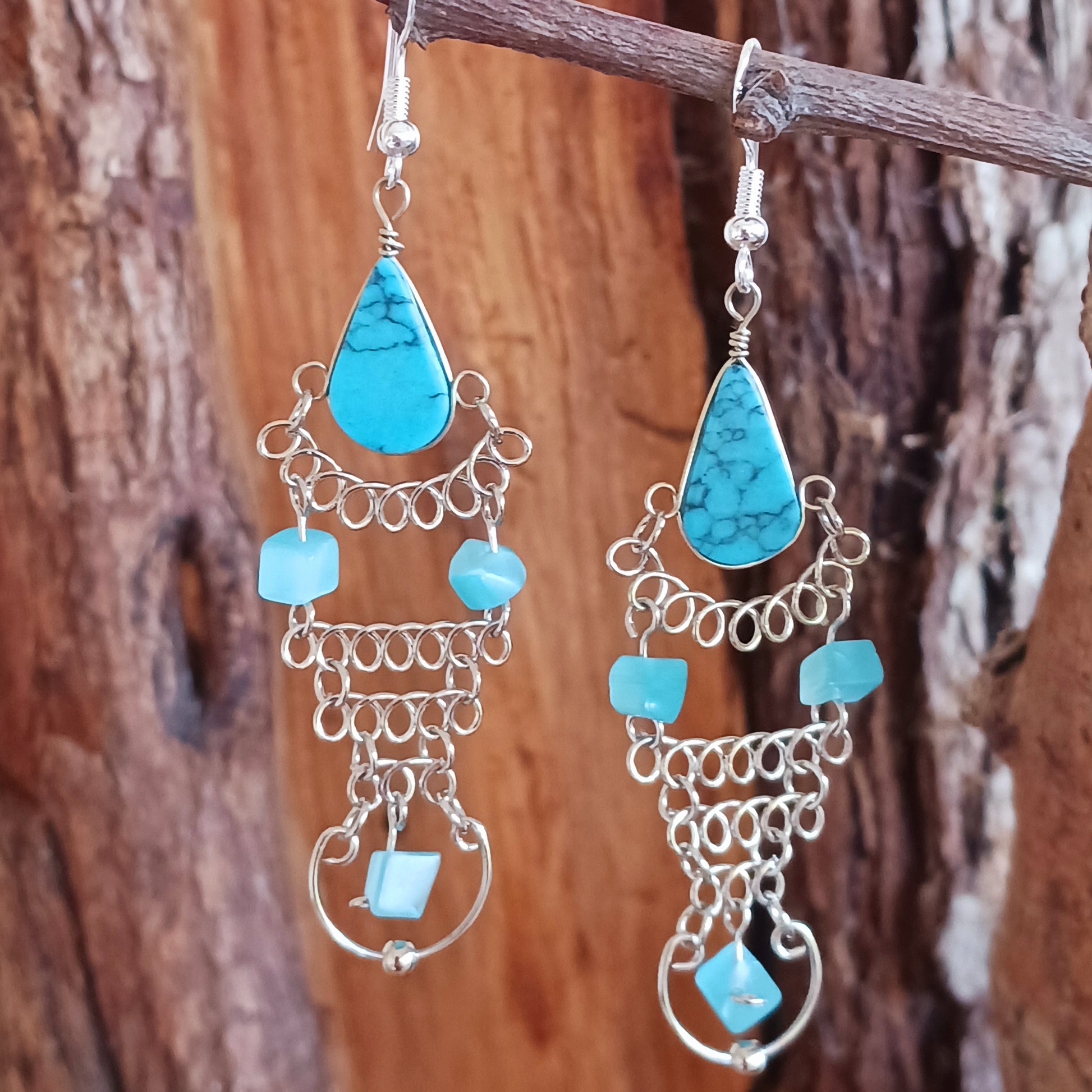 Add a touch of bohemian beauty to your look with these handmade Peruvian turquoise stone and beaded earrings. Featuring turquoise stones and finished with silver-plated hooks, each pair is carefully crafted in small workshops in Peru.