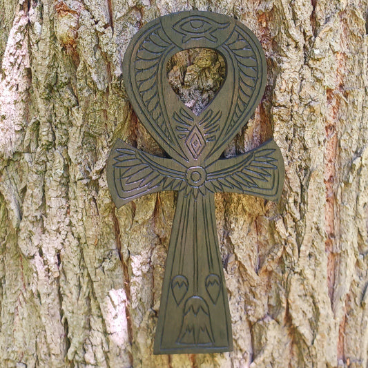 This beautiful and intricately carved wall plaque features a traditional symbol of the ancient Egyptians. The ankh is often interpreted as a symbol of life and eternal existence. Its looped top is thought to represent the eternal soul, while the straight line below symbolises the earthly plane or physical existence. Together, they signify the eternal cycle of life, death, and rebirth.
