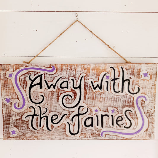 Whimsical handmade wall plaque with fairy-themed design. Ideal for gardens or interiors. Crafted in Indonesia with etched text and colourful star accents.