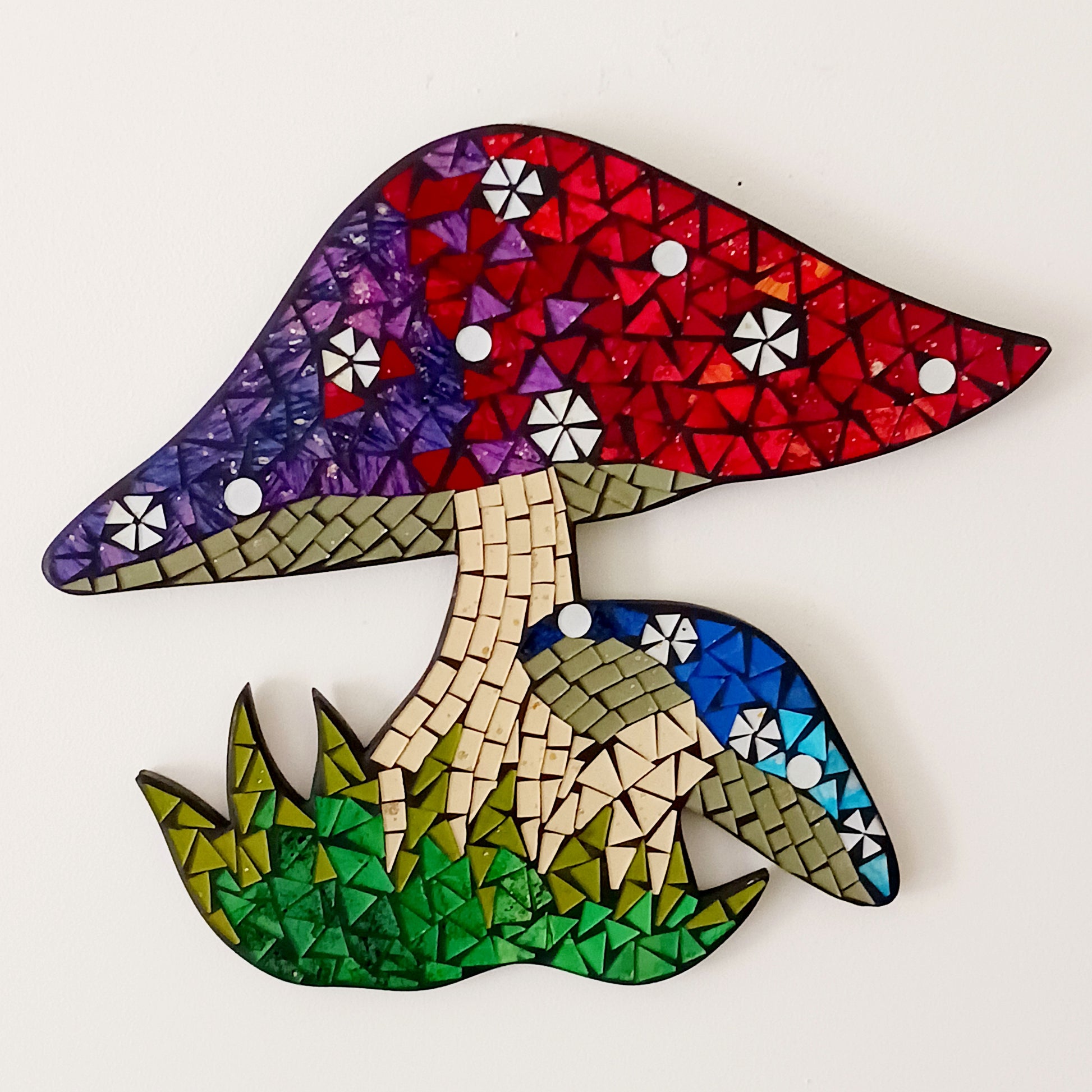 Bring a touch of enchantment to your home with this unique Mosaic Toadstool Plaque, a charming decorative accent designed to add warmth, personality, and whimsical style to any room. Featuring an adorable toadstool mushroom design with a beautiful mosaic-inspired finish, this unique wall plaque creates a magical focal point for your living room, bedroom, hallway, nursery, or creative space.