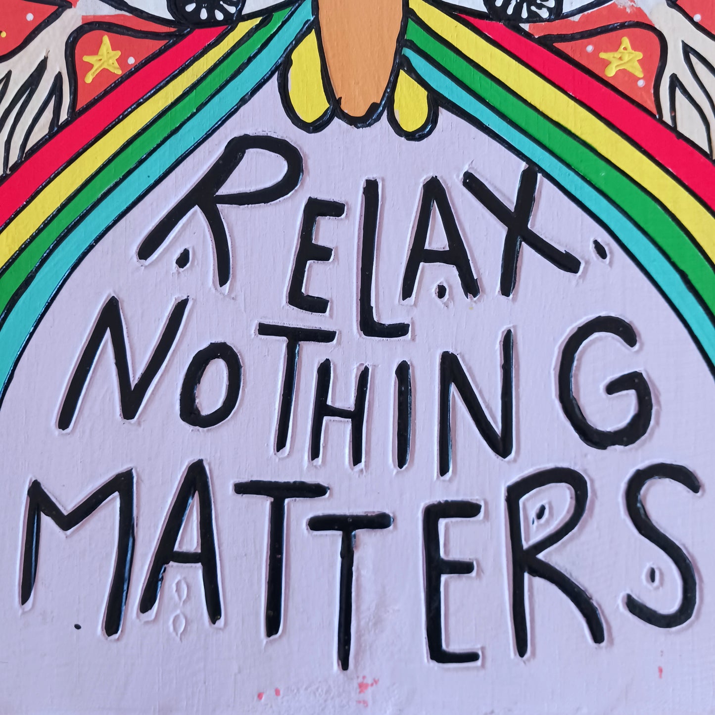 Add a splash of colour and carefree charm to your space with this Relax Nothing Matters Wall Plaque. Handmade by skilled artisans in Indonesia, this standout piece features a vibrant rainbow and whimsical mushroom in an abstract design.