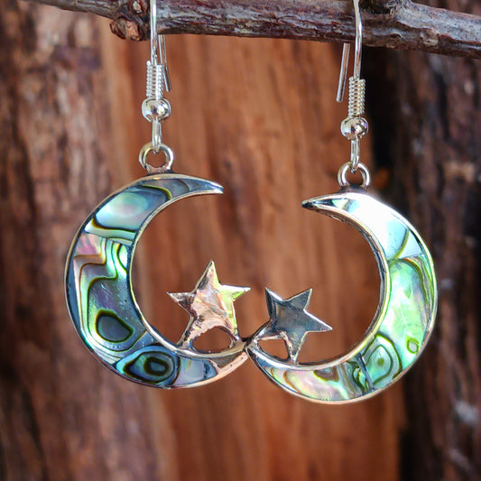 These stunning painted abalone earrings are beautifully crafted into a moon and stars shape. The fixing are silver plated. The earrings come in a recycled sari gift pouch.