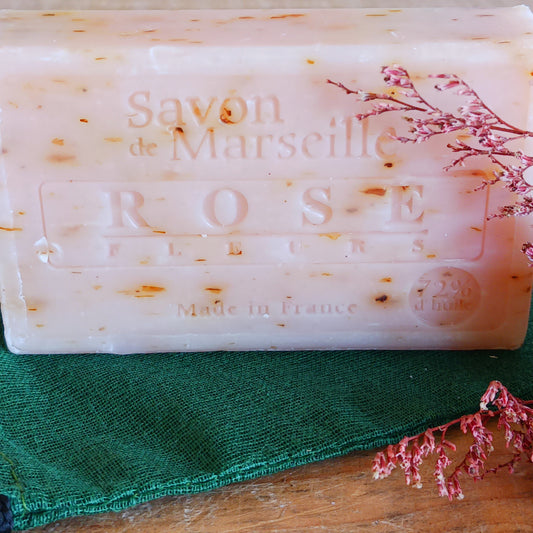Indulge your senses with our Natural Marseille Rose Petal Soap, handmade in the heart of Provence. Infused with real rose petals and a captivating floral aroma, this luxurious soap envelops your skin in an intense, long-lasting rose scent.