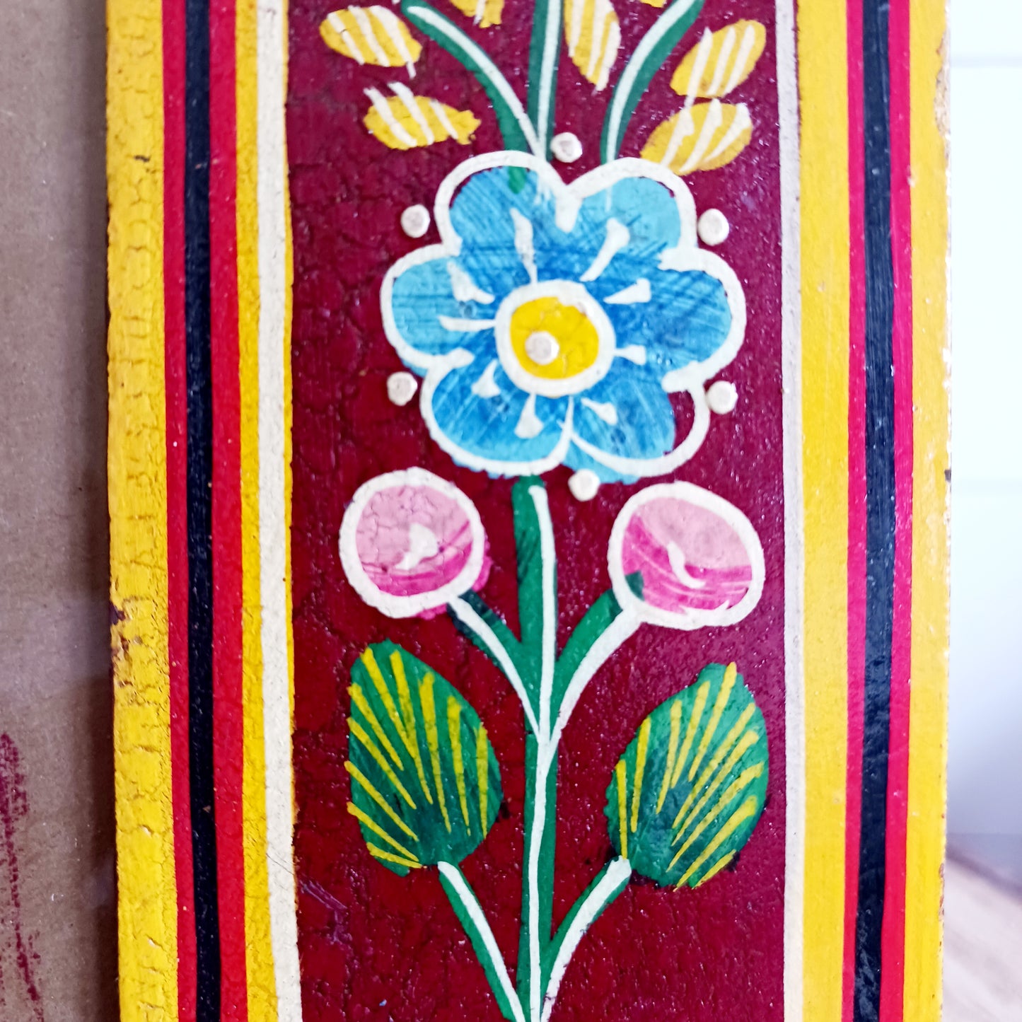 Add a touch of artisan charm to your home with this beautifully handcrafted mango wood photo frame. Made from sustainably sourced mango wood, each frame is carefully hand painted by skilled Indian artisans, featuring vibrant floral patterns that create a stunning tapestry of colour.