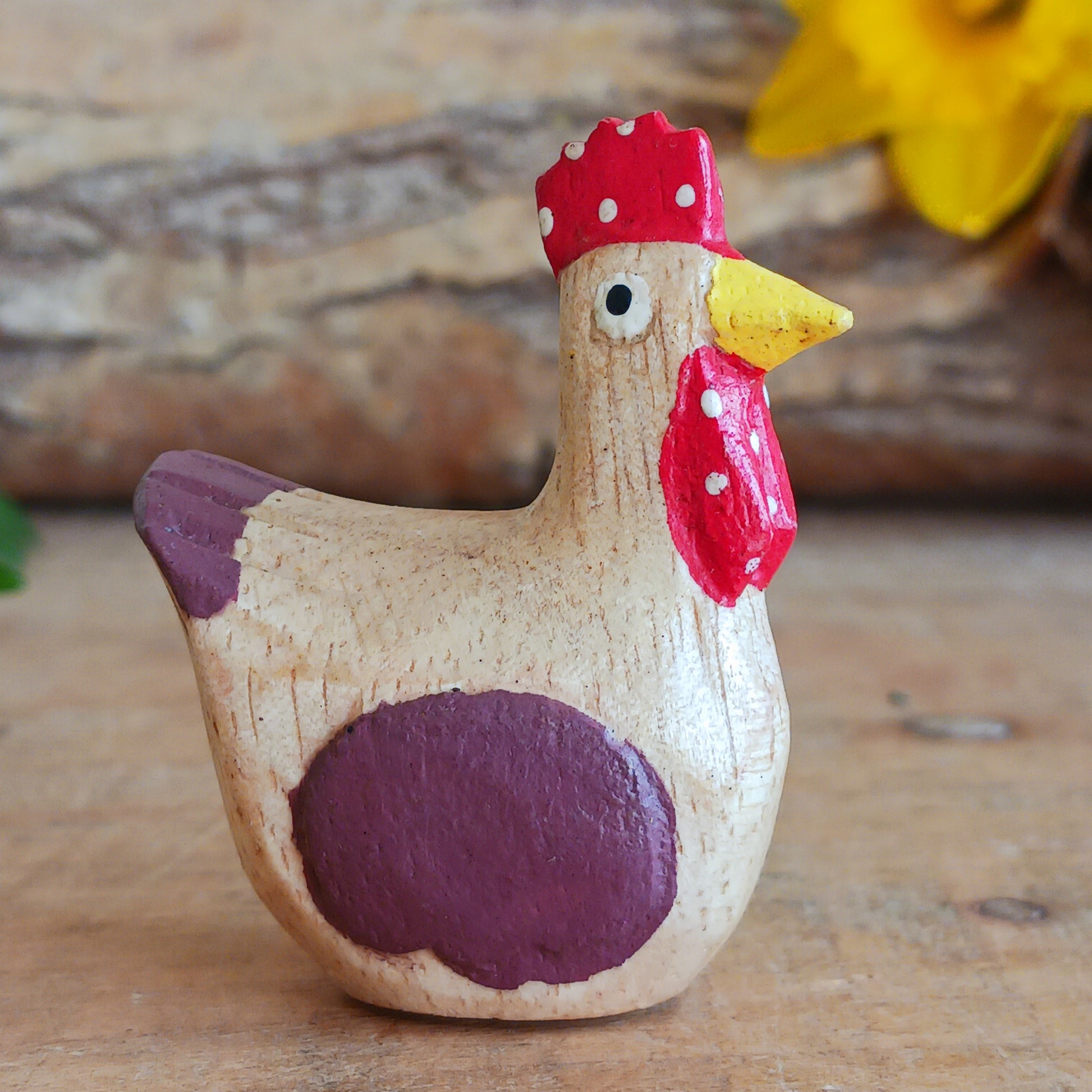 Add a touch of countryside charm to your home with this rustic mini wooden chicken ornament. Hand carved from sustainable Jempinis wood by skilled artisans in Indonesia, each piece is carefully painted in a rustic farmyard style that highlights the natural character of the wood.