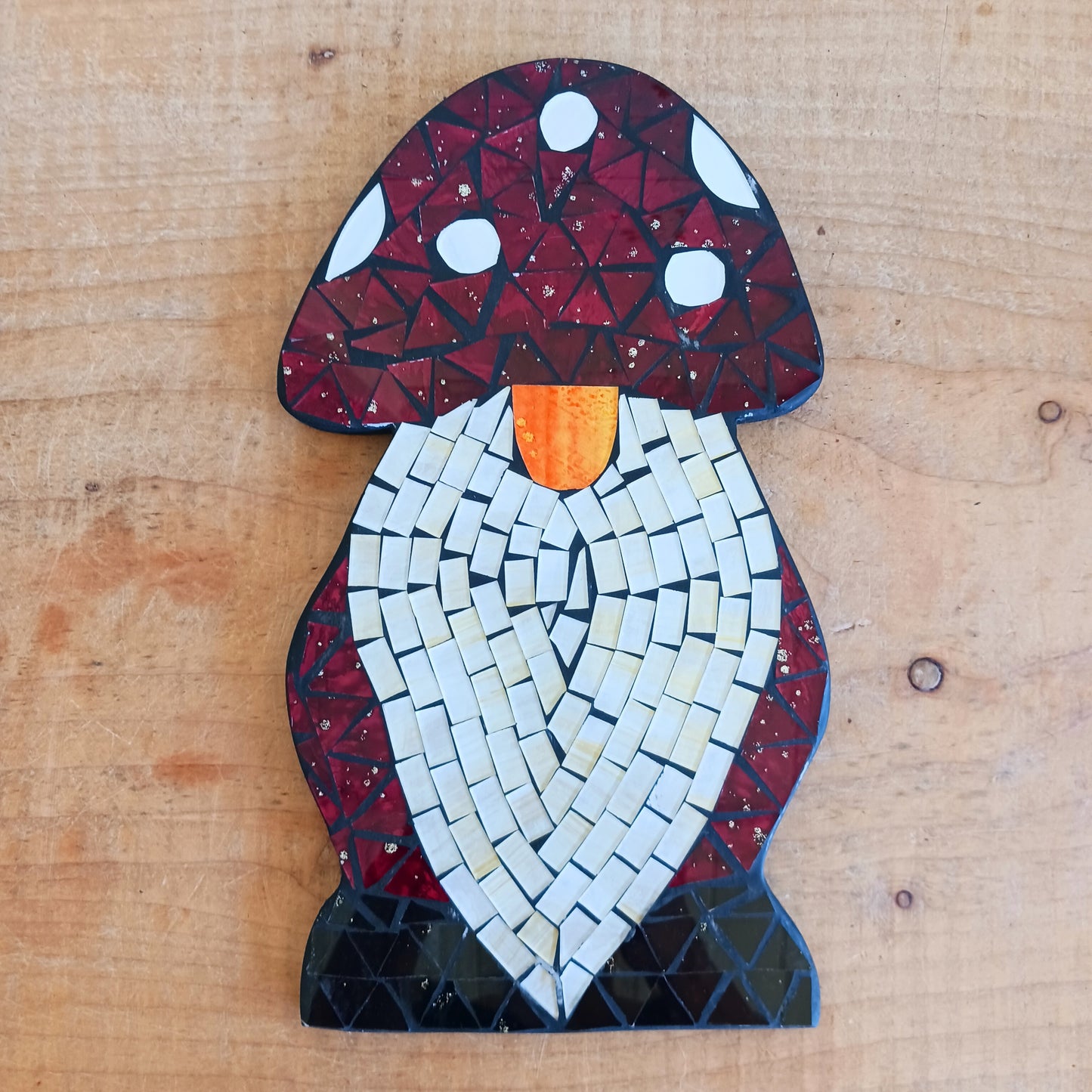 Bring personality and charm to your home with this Handcrafted Red Mosaic Gnome Wall Plaque. Featuring a delightful gnome design created with vibrant red mosaic tiles, this unique wall decoration adds a playful touch to any living space.