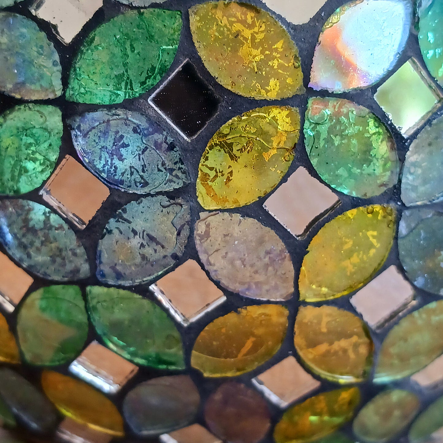 Add a warm, colourful glow to your home with this large and beautiful handmade Meena mosaic glass tealight holder, crafted by a World Fair Trade Organisation (WFTO) approved supplier in India.