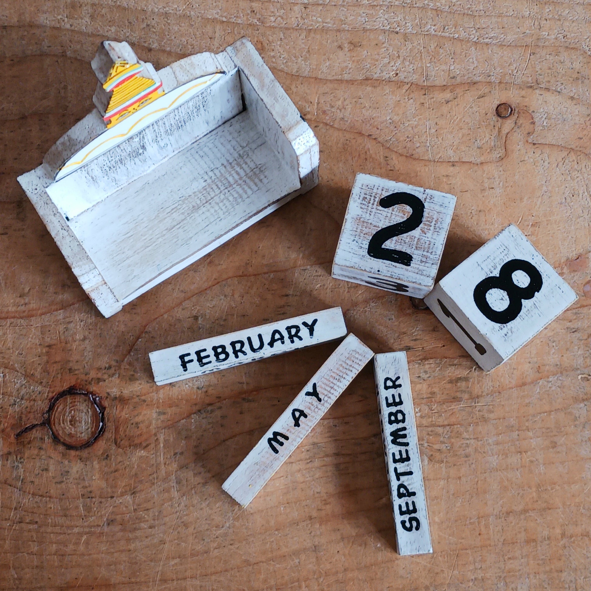 Bring a sprinkle of harmony to your everyday routine with the Nepal Stupa Wooden Calendar. Crafted from lightweight, durable wood, this enchanting piece combines functionality with fairy-tale charm. Each day, simply rotate the wooden blocks to keep track of the date—no need for replacements, making it a timeless addition to your home or office.