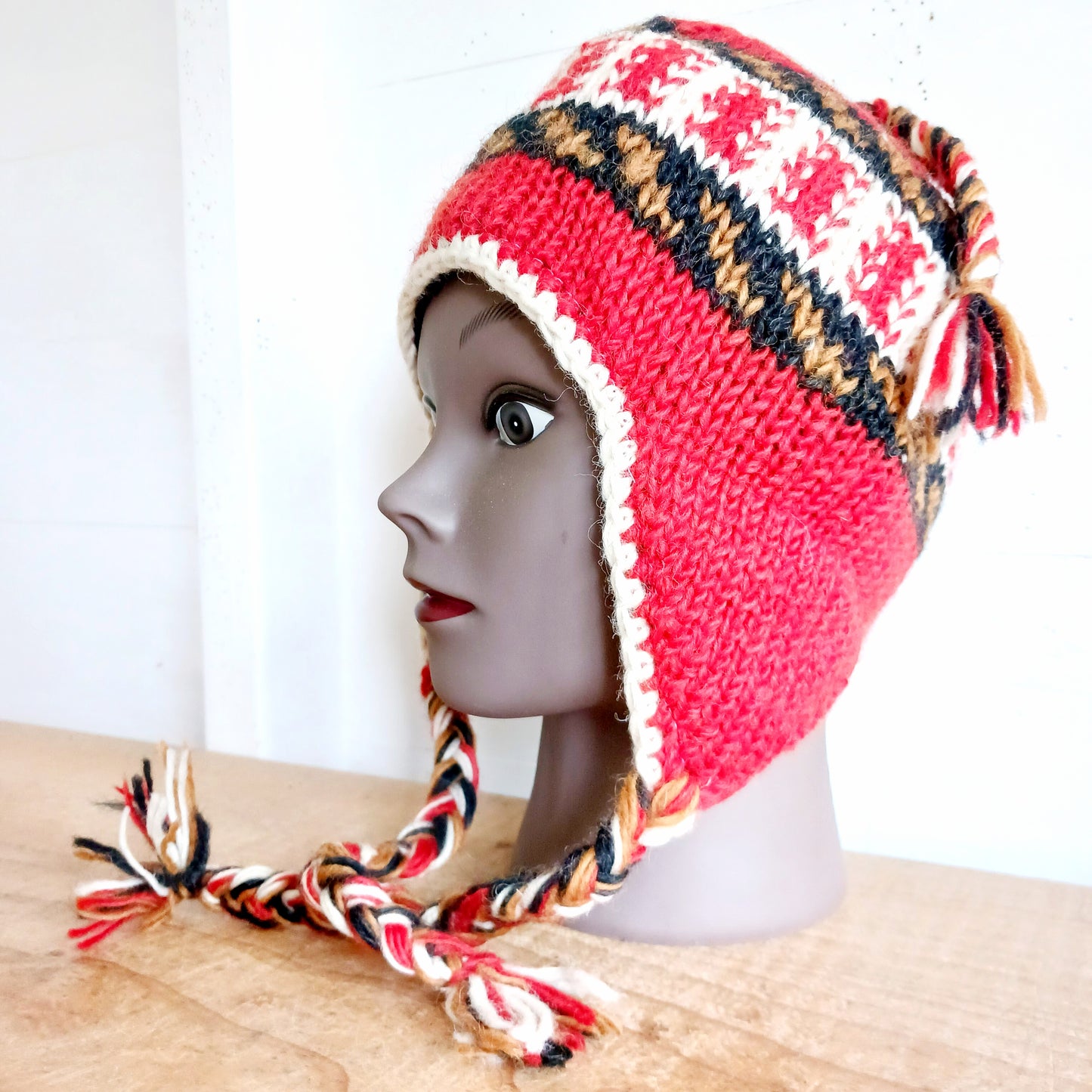 Stay cozy and stylish with our handmade chunky wool earflap hats, crafted in Nepal by skilled women artisans in Kathmandu. Each hat is 100% pure wool and features a soft polar fleece lining for extra warmth and comfort. Perfect for cold winter days, outdoor adventures, or adding a touch of handmade charm to your look.
