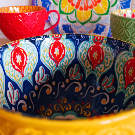 Bring Mediterranean charm to your kitchen with these beautiful Tuscany-inspired ceramic mugs. Featuring a vibrant glaze outside and embossed geometric patterns inside, they capture the rustic warmth of terracotta tiles and intricate murals found in sun-soaked Italian villages. The kaleidoscopic interiors add a burst of artistic flair, making them perfect for your morning coffee or evening tea. Stylish and versatile, these mugs are a thoughtful gift or a delightful treat for yourself.