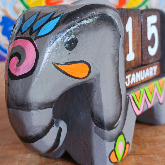Brighten up your desk with this charming hand-painted wooden elephant calendar! This cheerful desk-buddy is both practical and eco-friendly, making it a perfect addition to your work or study space. Simply rotate the wooden blocks each day to keep track of the date – no need to replace it year after year. A thoughtful, sustainable gift for elephant lovers, students, or anyone who enjoys unique handcrafted décor.