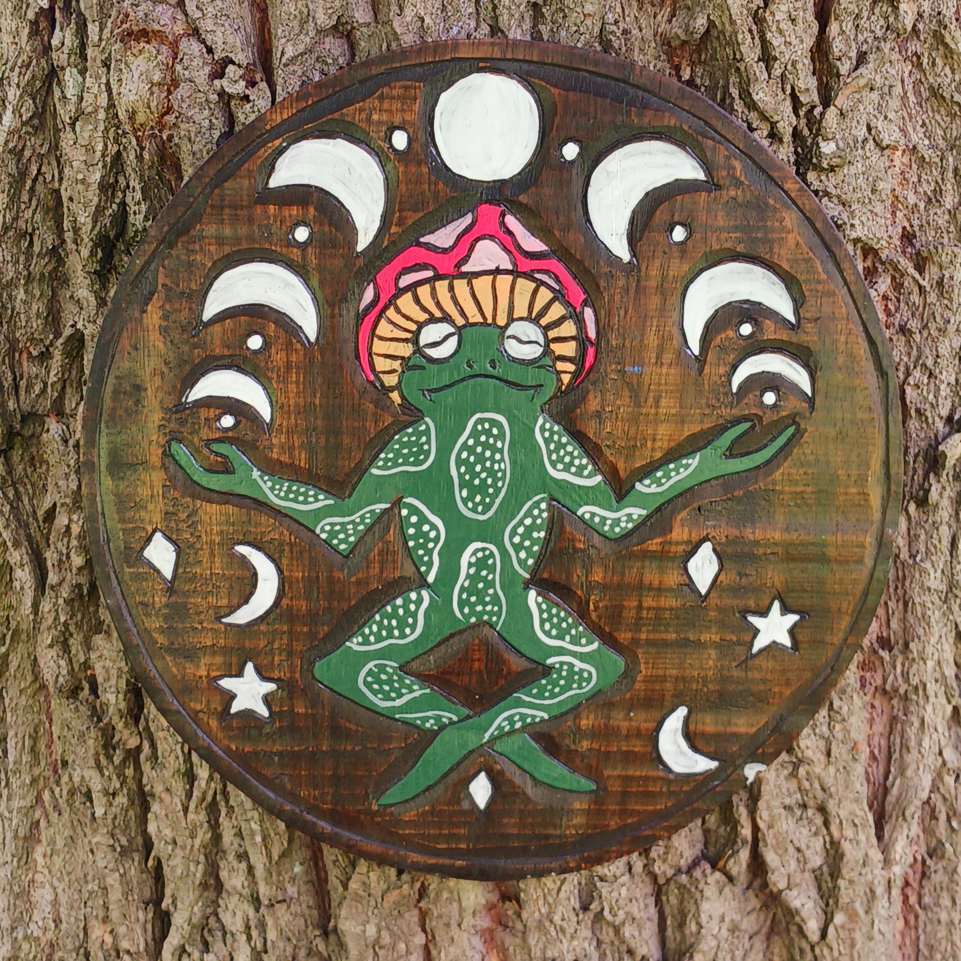 Bring a touch of fun, character, and artisan craftsmanship to your home with this Round Meditating Frog Wall Plaque, beautifully handmade by skilled artisans in Bali, Indonesia. Expertly hand carved from sustainable wood and carefully hand painted, each piece showcases unique details that celebrate traditional Balinese craftsmanship.