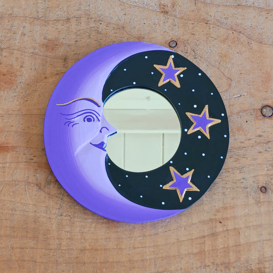 Bring celestial charm and positive energy into your home with this little Handmade Purple Moon Mirror. Carefully crafted by Fair Trade artisans, this unique decorative mirror features a stunning purple crescent moon design that adds a mystical and spiritual touch to any room.