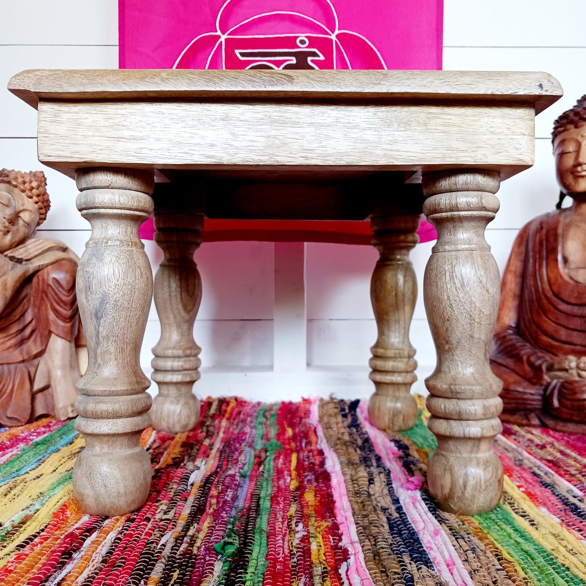 Bring peace and tranquillity to your home with this beautiful handcrafted mango wood table, featuring an intricately carved Buddha and Lotus Flower design on the tabletop. Combining traditional craftsmanship with spiritual symbolism, this unique wooden table makes a wonderful addition to a meditation space, Buddhist altar, yoga room or peaceful home sanctuary.