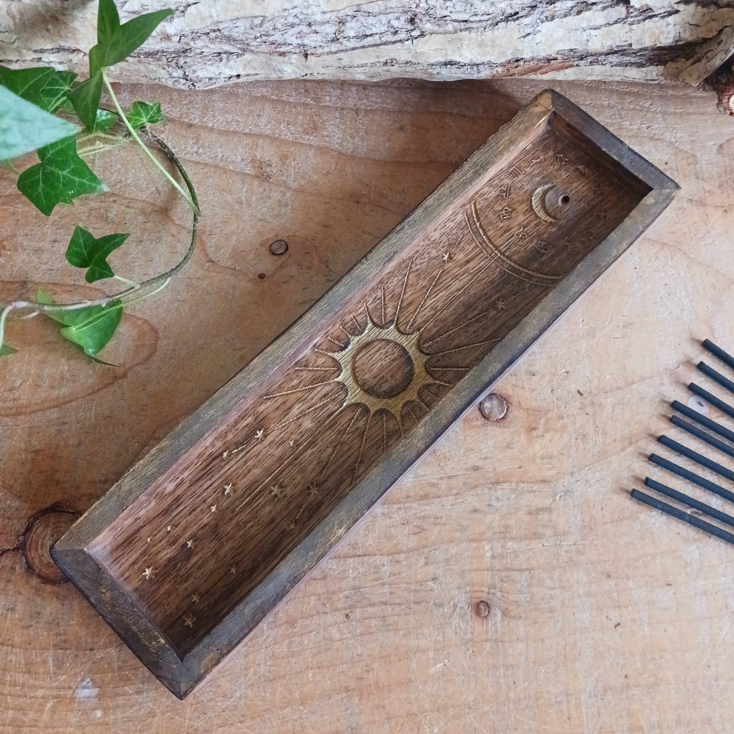 This Zodiac Incense Holder and Crystal Tray is a beautifully crafted ritual accessory made from natural mango wood and finished with gold-stamped astrological symbolism. Designed to hold incense sticks while offering a dedicated tray space for crystals or ritual objects, it brings structure and intention to daily practice.