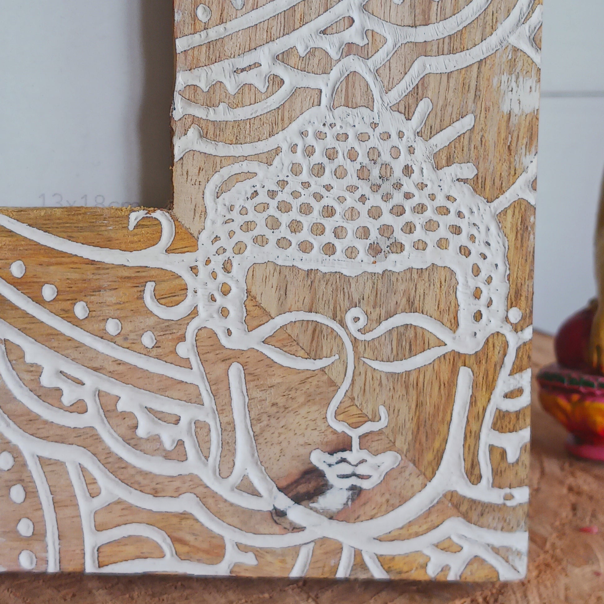 Made in India from sustainably sourced mango wood, these lovely picture frames bring warmth, character, and meaning to any space. Each one is carefully carved or painted with spiritual and cultural designs that go beyond decoration holding deep symbolism and tradition. The small Buddha in the corner is a peaceful presence that represents wisdom and enlightenment. Ideal for meditation spaces, yoga studios, or anyone seeking a sense of calm.