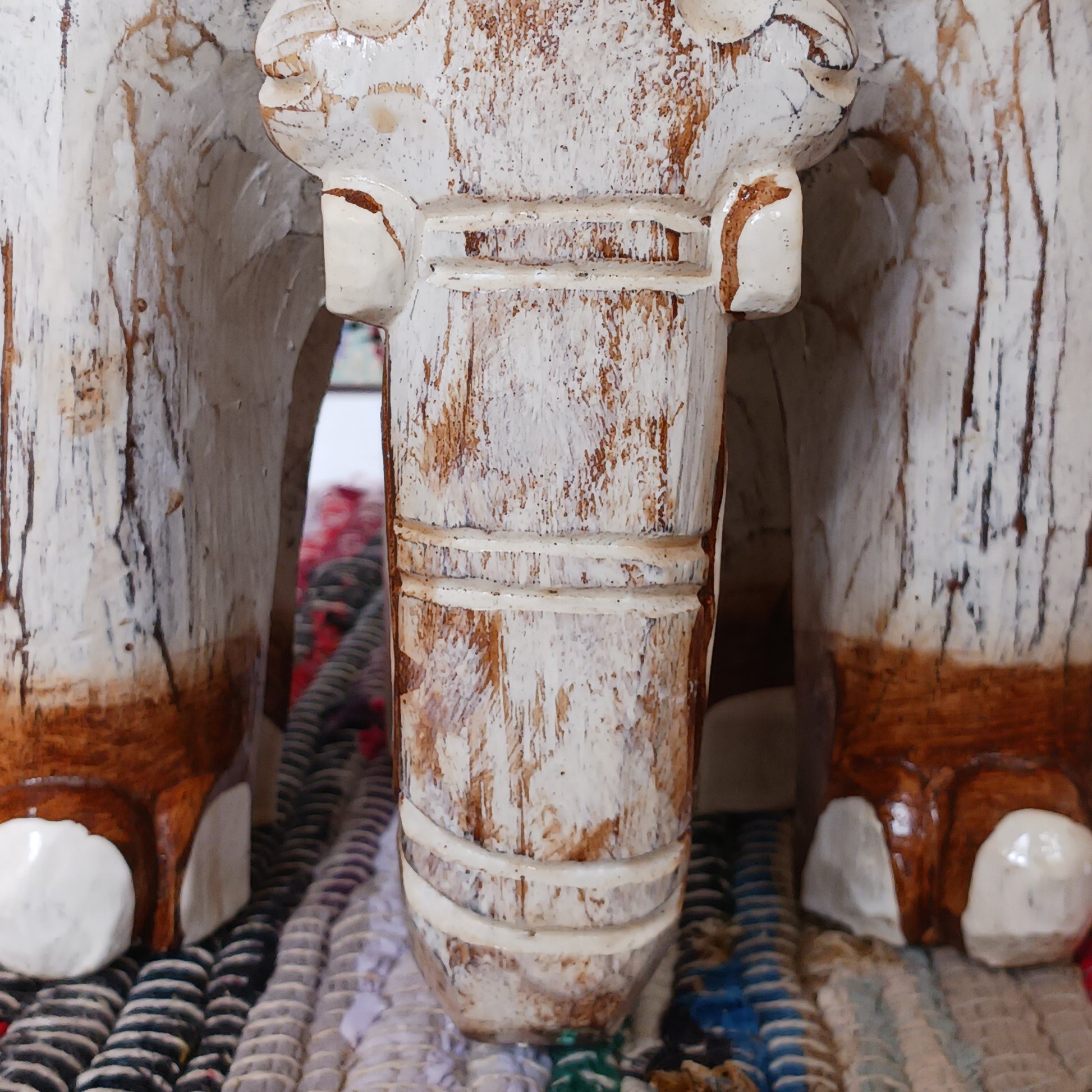 Hand carved from ableisa wood, this stunning elephant makes a great side table, coffee table. plant table or stool. This beautiful elephant piece is handmade and painted by artisans who have strong roots in storytelling and artwork that spans generations - this elephant is the perfect example!