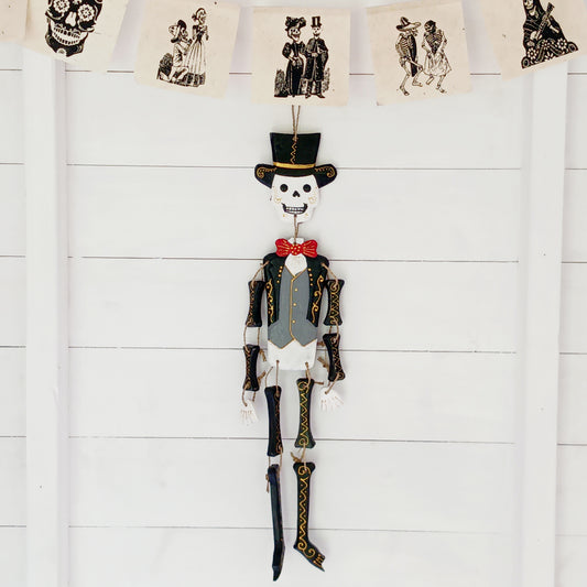 Hand-painted Day of the Dead skeleton inspired by Mexican calaveras. Handmade in Bali. A unique decorative piece for home or Día de los Muertos.