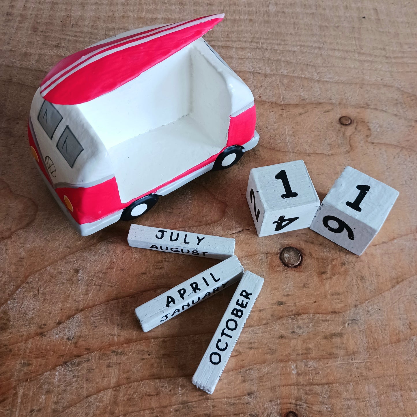 Bring the feeling of endless summer into your space with this cute red and white Camper & Surfboard Perpetual Calendar. Featuring a retro-inspired camper with a surfboard on top, this design captures the spirit of freedom, adventure, and life on the open road.