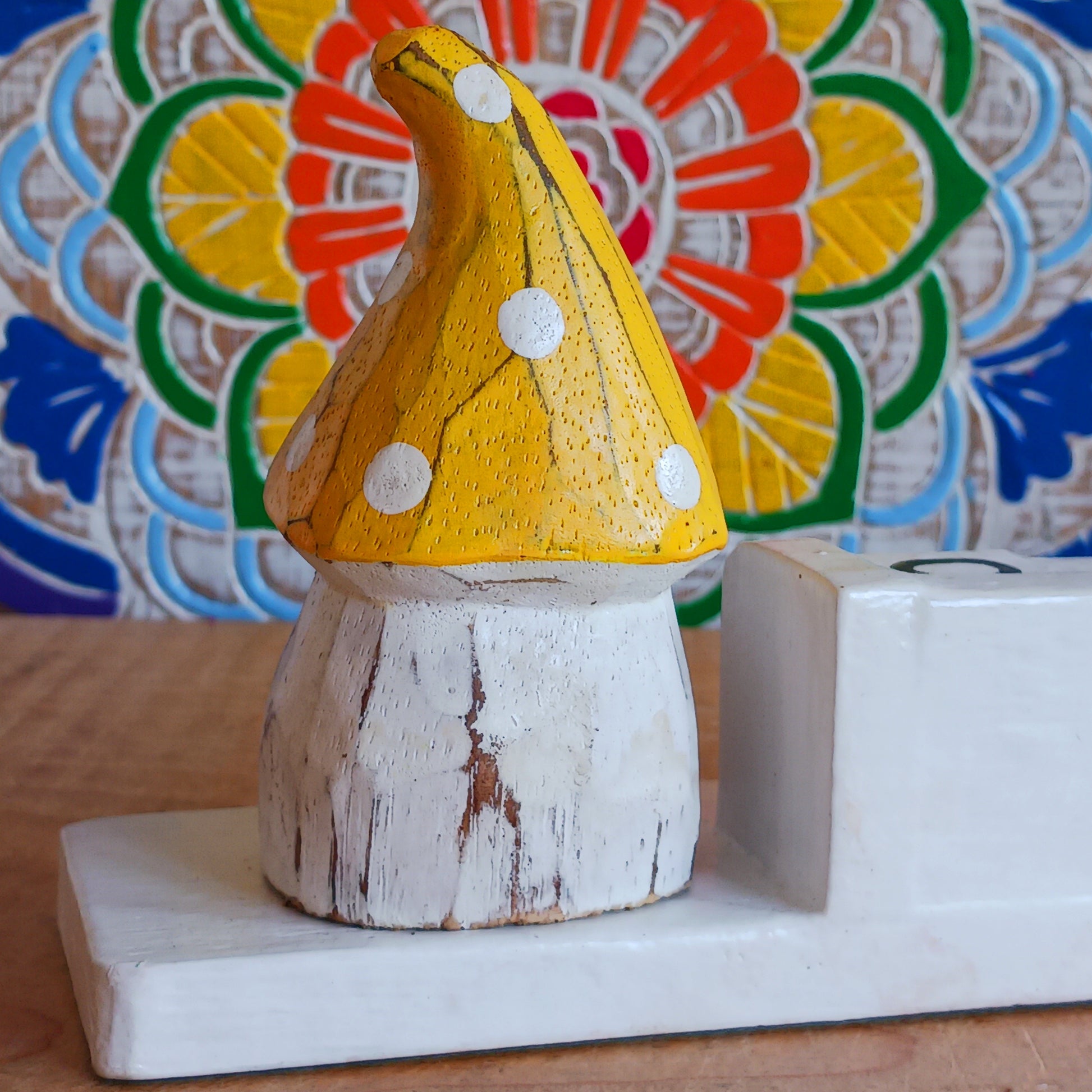 Bring a sprinkle of magic to your everyday routine with the Mushroom House Wooden Calendar. Crafted from lightweight, durable wood, this enchanting piece combines functionality with fairy-tale charm. Each day, simply rotate the wooden blocks to keep track of the date—no need for replacements, making it a timeless addition to your home or office.