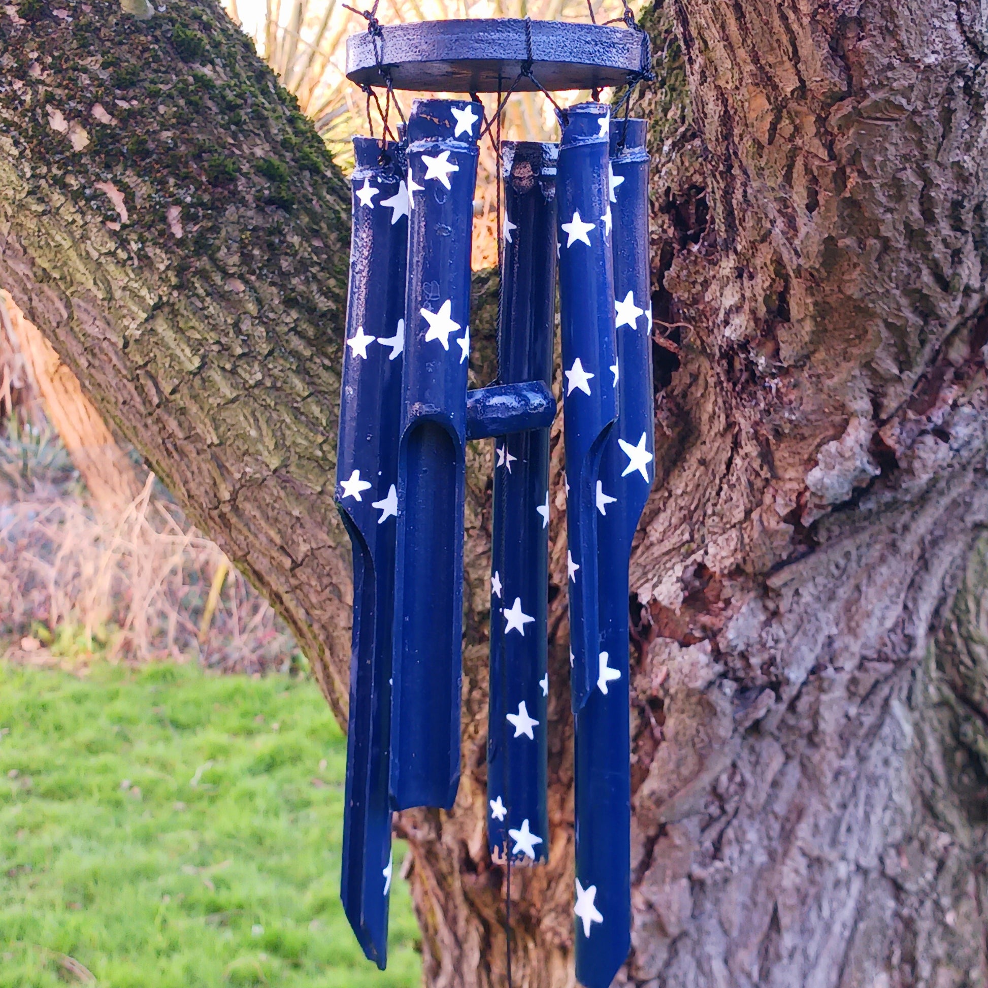 This great sounding bamboo windchime is perfect for hanging in a tree or from a wall in your garden, or even in your bedroom! This windchime has been hand painted in a calming night sky design - bringing calm to whichever place you hang it.