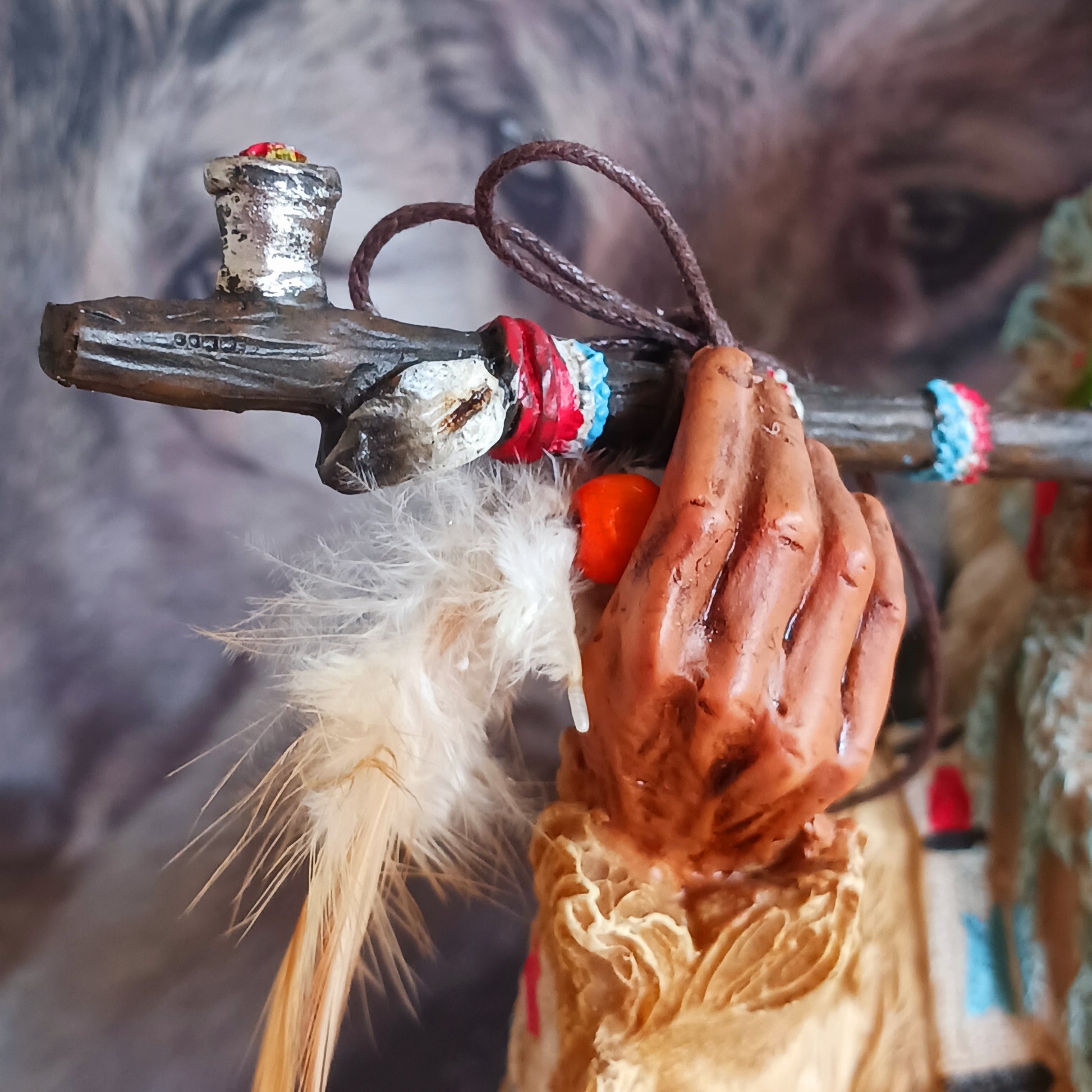Elevate your space with the serene elegance of this Native American Chief Smoking a Peace Pipe figurine, a captivating symbol of wisdom and cultural harmony. Expertly crafted with intricate detail, this masterpiece depicts a noble chief in traditional tribal attire, smoking a symbolic peace pipe with grace and dignity. From the regal feathered headdress to the delicate carving of the pipe, every element reflects the artistry and cultural depth of Native American traditions. 