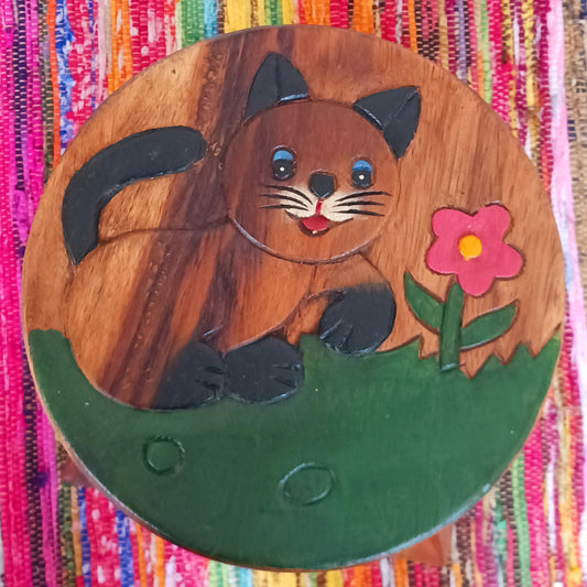 Bring a sprinkle of wonder into your sacred space with this charming hand-painted Cute Cat Stool. Carved from sustainable wood and finished with natural wax, it’s not just adorable—it’s versatile too. Whether you're grounding yourself on it during morning meditation, using it as a fairy table for crystals and incense, or just resting your weary feet, this little cat is pure joy.