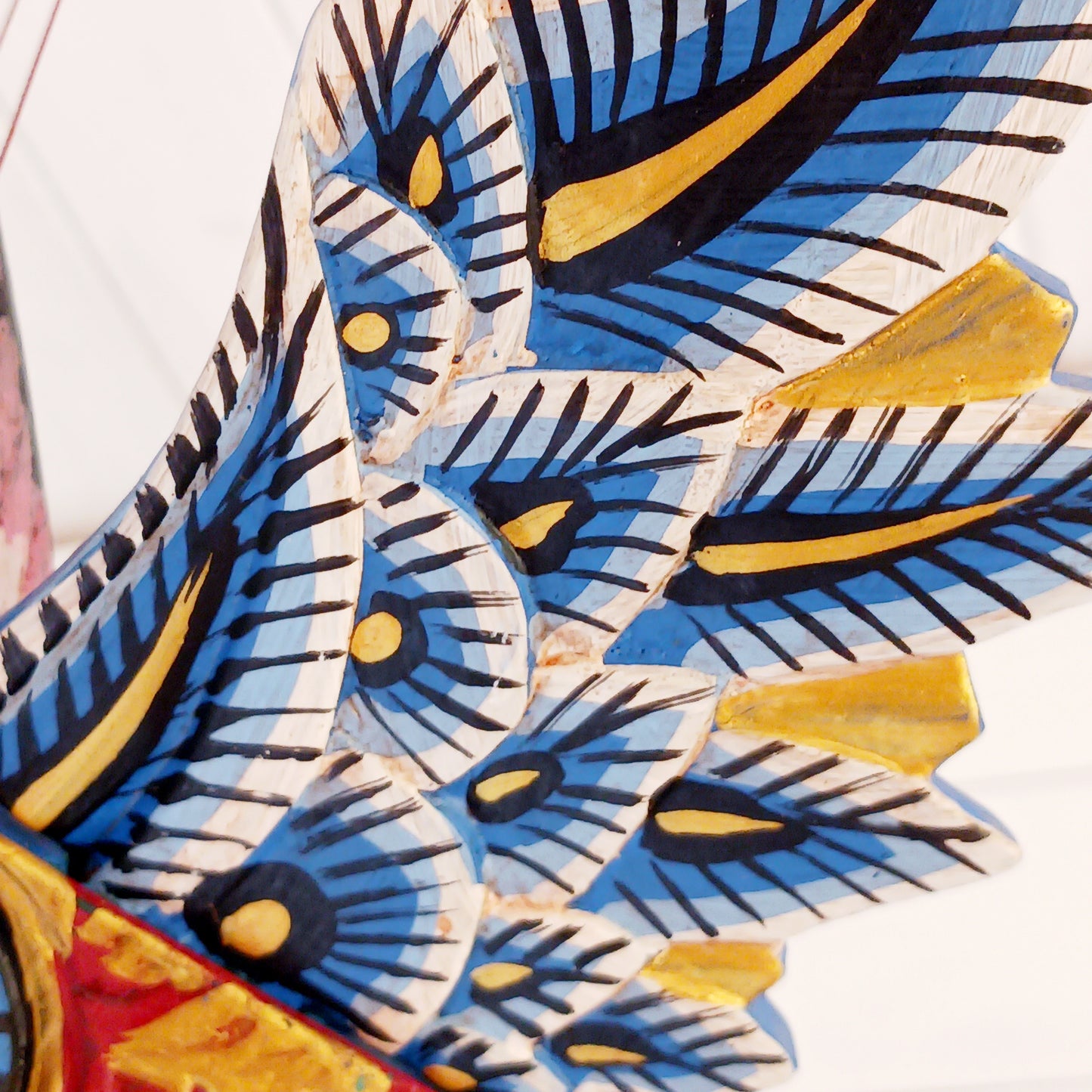 Bring a touch of fantasy to your home with this beautifully handcrafted winged seahorse hanging mobile. Hand-painted in vivid cobalt blue, this enchanting wooden seahorse features intricate painted scales, feather-like detailing and traditional Balinese-inspired decoration.