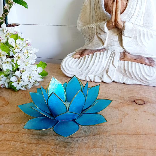 The Lotus Flower is a symbol of achieving enlightenment, peacefulness and spirituality. This beautiful candle holder can be fitted with tealight candles or slightly larger candles. The diameter of the middle is roughly 5.5cm, so it will fit any candle with the same diameter.
