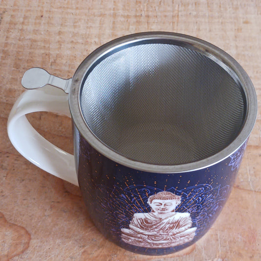 Bring peace and tranquility to your tea ritual with this beautifully crafted China tea mug featuring a serene blue Buddha design. Made from fine porcelain, it includes a high-quality stainless steel infuser perfect for loose-leaf tea. The set comes elegantly packed in a sturdy cardboard gift box, making it an ideal present for tea lovers, yoga enthusiasts, or anyone who appreciates mindful living.