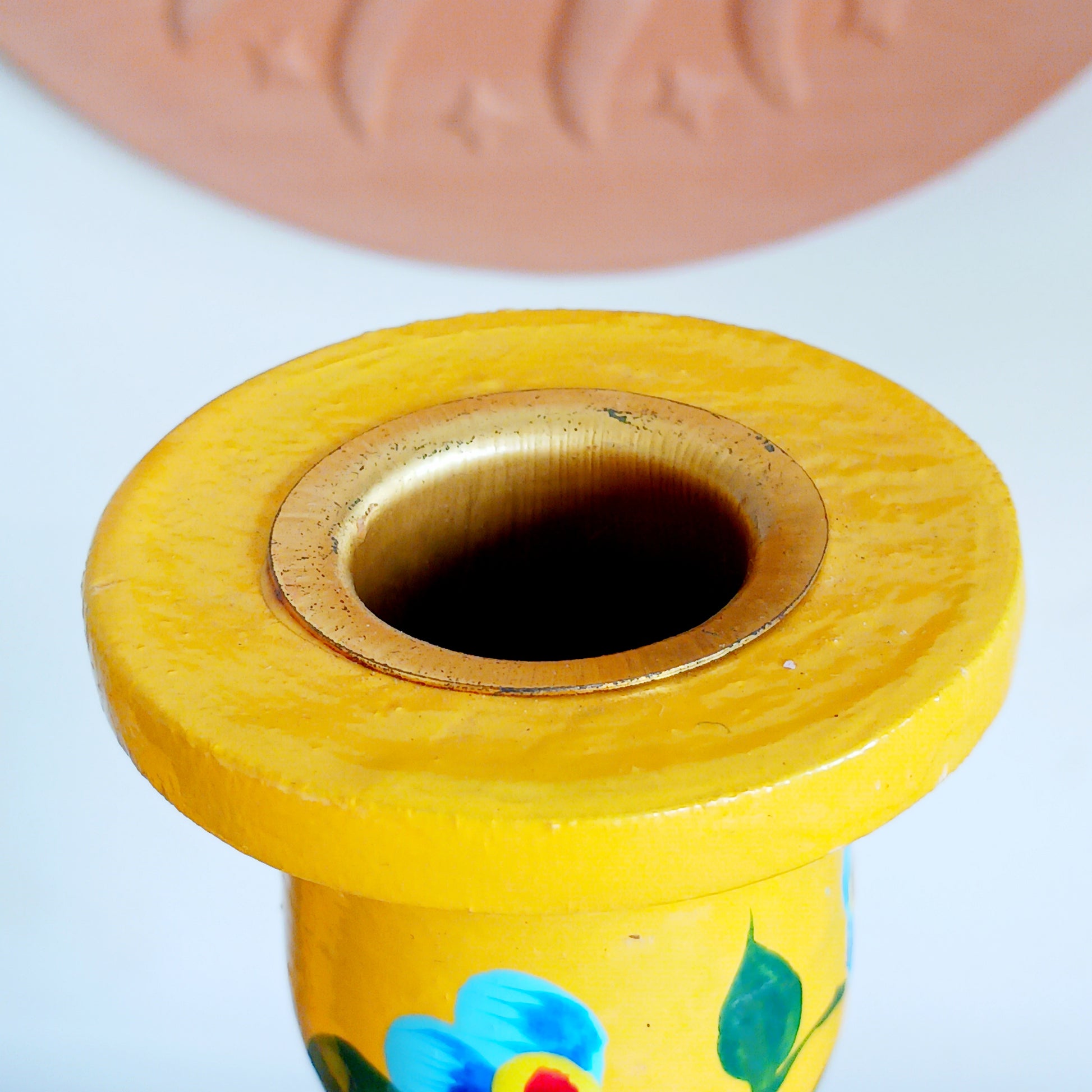 Add warmth, colour, and artisan beauty to your home with these hand painted yellow wooden candlesticks, beautifully crafted from sustainably sourced wood. Each piece is carefully painted by skilled artisans and decorated with elegant chrysanthemum flowers, a symbol of positive life forces including love, appreciation, longevity, happiness, and optimism.