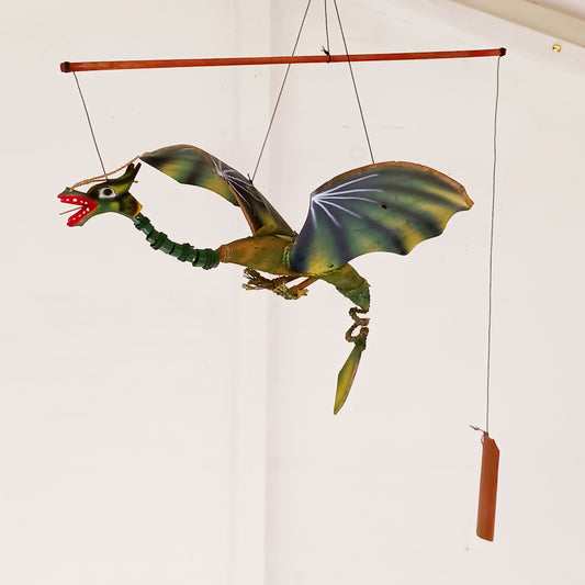 Bring a touch of magic and movement to your home or garden with this Large Green Coconut Dragon Mobile, a beautifully handcrafted decorative piece handmade in Indonesia.