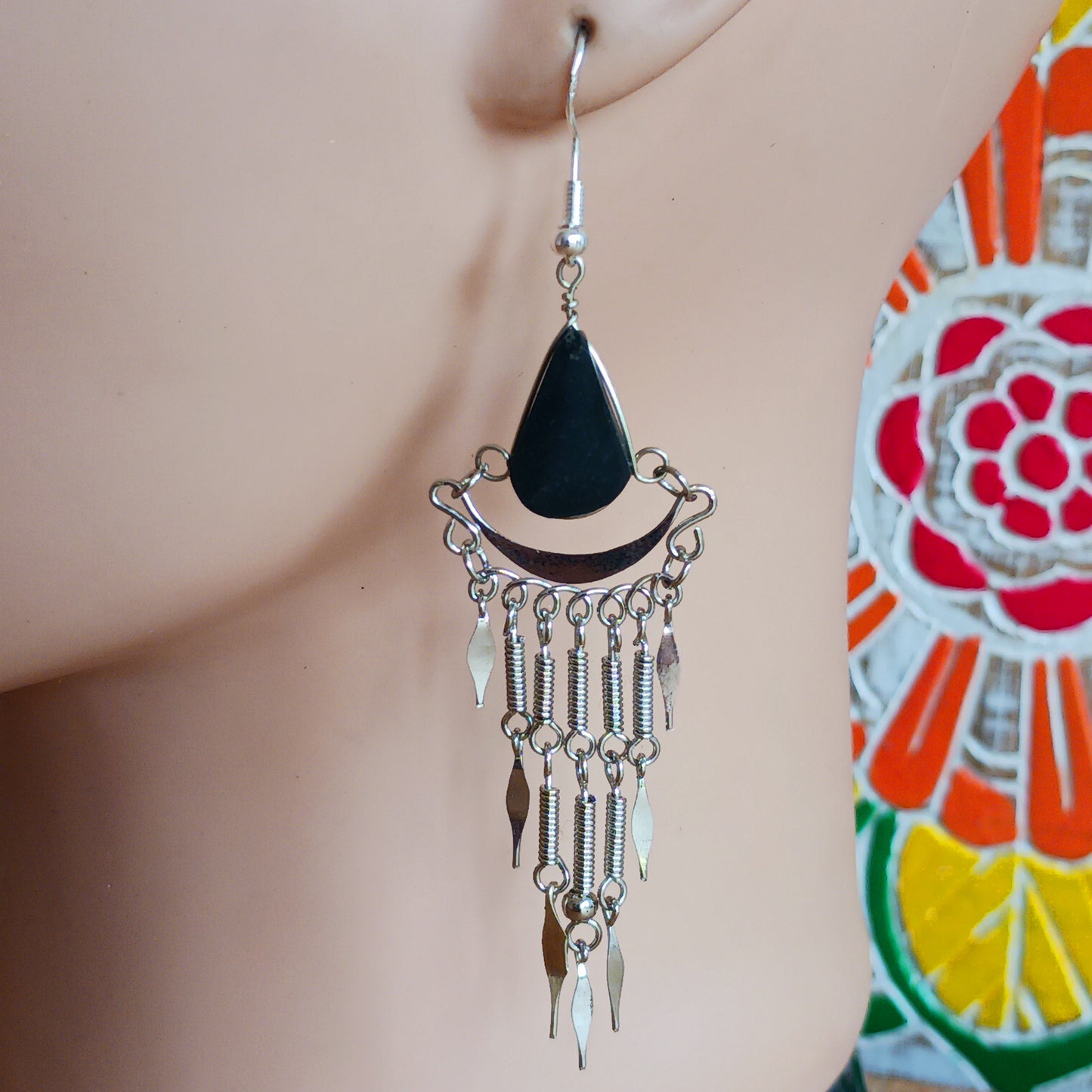 Add a touch of bohemian beauty to your look with these handmade Peruvian stone earrings. Featuring black stones and finished with silver-plated hooks, each pair is carefully crafted in small workshops in Peru.