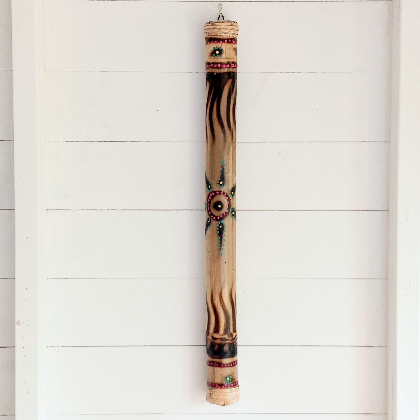 Bring the soothing sound of rainfall into your home with this beautifully handcrafted bamboo rainstick. Made using a hollow length of natural bamboo, this traditional percussion instrument creates a calming rain-like sound effect that is perfect for meditation, sound healing, relaxation, music sessions, classrooms, or unique home décor.